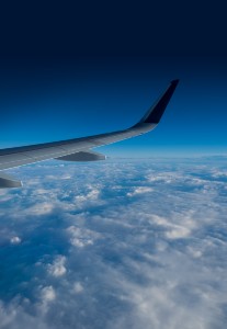 https://westchestertravel.com/wp-content/uploads/2022/05/wing-of-an-airplane-flying-above-the-clouds-2022-02-07-09-57-25-utc.jpg